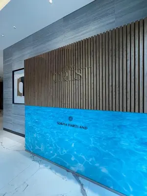 a sign for the sana hotel and a swimming pool at Elegant 1-Bedroom The Crest, Near Downtown Dubai in Dubai