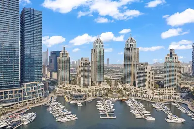 a group of boats in a harbor in a city at Luxury 1BR Apt at LIV Marina with Direct Marina Views in Dubai