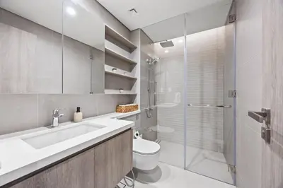 a bathroom with a sink and a toilet and a shower at Luxury 1BR Apt at LIV Marina with Direct Marina Views in Dubai