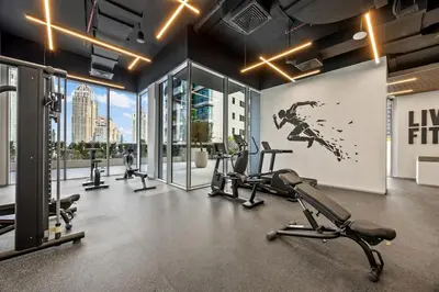 a gym with treadmills and cardio machines in a building at Luxury 1BR Apt at LIV Marina with Direct Marina Views in Dubai