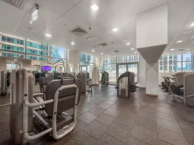 a gym with rows of chairs in a building at FIRST CLASS 1BR Central Dubai Luxury Living in Dubai