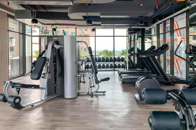 a gym with a bunch of treadmills and machines at Spacious Balcony with Breathtaking Creek Views, Just a Short Drive from Zabeel Stadium, Al Jaddaf Walk, and Cactus Park, Binghatti Avenue, Al Jaddaf by Deluxe Holiday Homes in Dubai