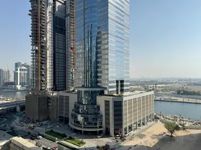 an aerial view of a tall building under construction at Modern 2BR Apartment in Merano Tower, Business Bay in Dubai