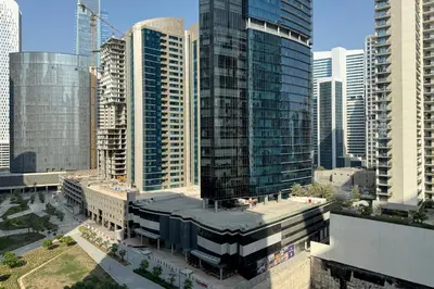 an aerial view of a city with tall buildings at Modern 2BR Apartment in Merano Tower, Business Bay in Dubai