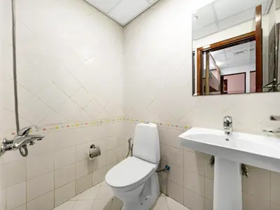 a bathroom with a toilet and a sink at Centric Flat w Marina View, Ideal Beach Stay Big Terrace Sleep 9 in Dubai