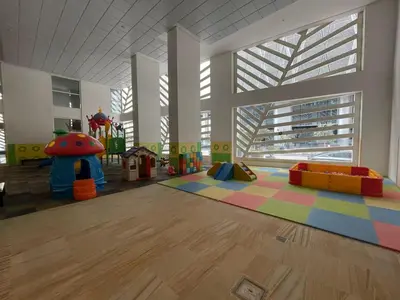 a large room with a play room with a playground at Vogue Downtown Mon Reve near Burj Khalifa and Dubai Mall, Two Bedroom plus kids room Apartment with Balcony and Access to all Amenities in Dubai