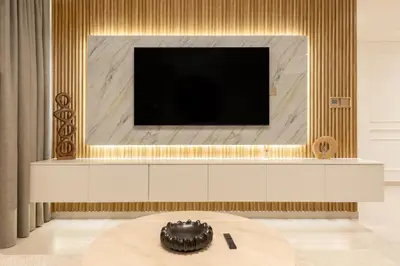 a living room with a tv and a table at Spacious 2BR with Burj Khalifa View in Downtown Dubai in Dubai
