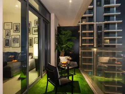 a room with a table and a chair in a room with windows at Stylish 2 bedroom - Marina Views - Private Beach in Dubai