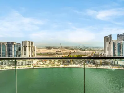 a view of a city with a body of water at Modern Studio with Jacuzzi and Premium Amenities in Dubai