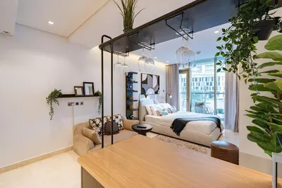 a bedroom with a bed and a large mirror at Smart Studio in Business Bay Near Burj Khalifa in Dubai