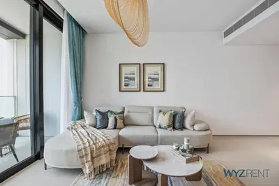 a living room with a couch and a table at Deluxe 1 BR in The Address JBR Beachfront Access in Dubai