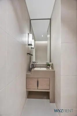 a bathroom with a sink and a mirror at Deluxe 1 BR in The Address JBR Beachfront Access in Dubai
