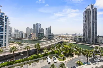 a city with tall buildings and cars on a highway at Deluxe 1 BR in The Address JBR Beachfront Access in Dubai