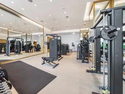 a gym with lots of treadmills and machines at Deluxe 1 BR in The Address JBR Beachfront Access in Dubai