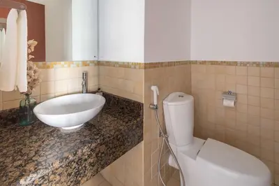 a bathroom with a white toilet and a sink at Frank Porter - Sadaf 7, JBR in Dubai