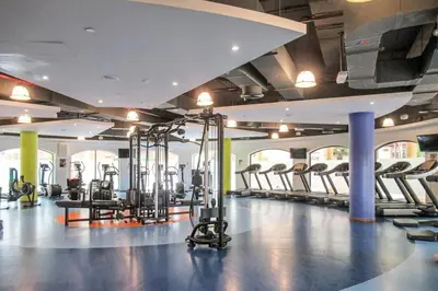 a gym with a lot of treadmills and machines at Frank Porter - Sadaf 7, JBR in Dubai