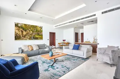 a living room with two couches and a table at Frank Porter - Tiara Residence Diamond North 4 in Dubai