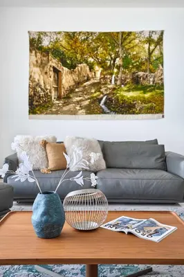 a living room with a couch and a table at Frank Porter - Tiara Residence Diamond North 4 in Dubai