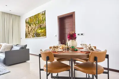 a dining room with a table and chairs at Frank Porter - Tiara Residence Diamond North 4 in Dubai