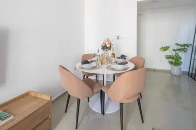 a dining room with a table and chairs at Frank Porter - Marina Wharf 1 in Dubai