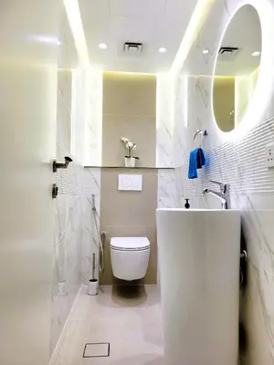 a bathroom with a white tub and a toilet at Apartment in Dubai Marina with Sea View & Balcony & Pool in Dubai