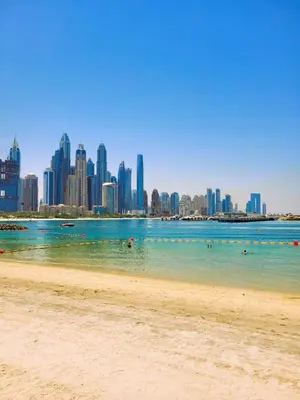 a view of a beach with a city in the background at Apartment in Dubai Marina with Sea View & Balcony & Pool in Dubai