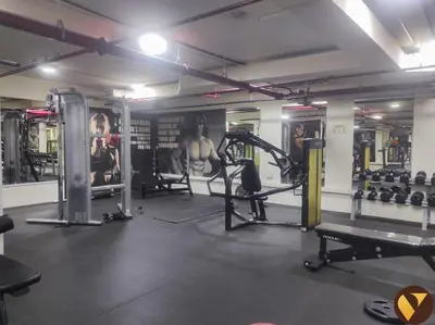 a gym with lots of equipment in a room at Vogue Business Bay - Bay Square Close to Downtown, Burj Khalifa and Dubai Mall, Studio Apartment with Balcony and City View, Access to all Amenities in Dubai