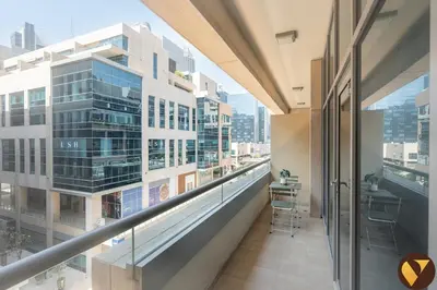 a balcony with a view of a building at Vogue Business Bay - Bay Square Close to Downtown, Burj Khalifa and Dubai Mall, Studio Apartment with Balcony and City View, Access to all Amenities in Dubai