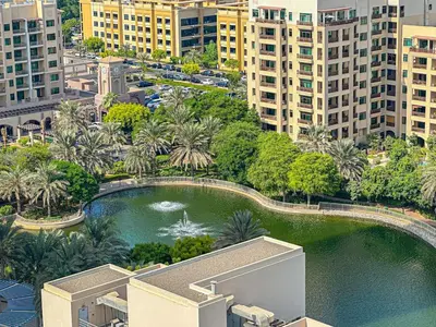 an aerial view of a pool of water in a city at HiGuests - 2 BR Escape Golf View Haven in The Greens in Dubai