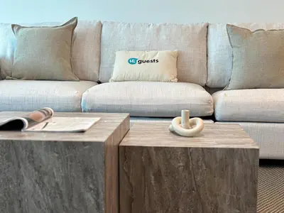 a living room with a couch and a coffee table at HiGuests - 2 BR Escape Golf View Haven in The Greens in Dubai