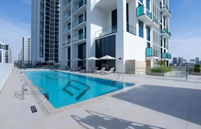 a swimming pool on the side of a building at Modern 1BD APT In Binghatti Burj Khalifa Skyline in Dubai