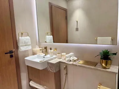 a bathroom with a sink and a mirror at Modern 1BD APT In Binghatti Burj Khalifa Skyline in Dubai