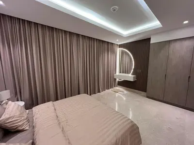 a bedroom with a large bed and a window at Mahenti - Mesmerizing views of The Burj & Downtown Dubai in Dubai