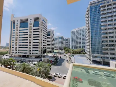 a view from a balcony of a city with tall buildings at Mahenti - Elite 1 · Large balcony with all u need in Dubai