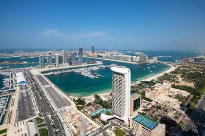 an aerial view of a city with a harbor at Stylish 2BR Balcony Palm Jumeirah Views in Dubai