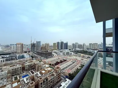 a view of a city from a building at Mahenti - Sunlit Spacious Apartment in JVC in Dubai