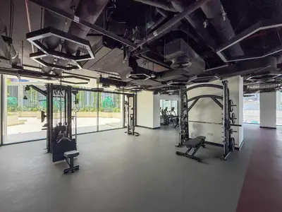 a gym with several treadmills and exercise equipment at Frank Porter - The Paragon in Dubai
