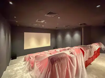 a bed in a room with avertisement at Frank Porter - The Paragon in Dubai