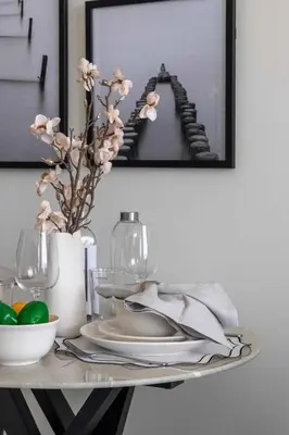 a table with plates and a mirror on a wall at Frank Porter - Samana Golf Avenue in Dubai