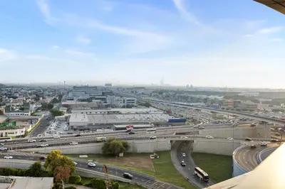 an aerial view of a highway with traffic at Elegant 1BR Flat in Business Bay with Pool & Gym in Dubai