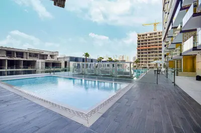 a large swimming pool on top of a building at Deluxe Binghatti JVC Suites by Hostiva - City View in Dubai