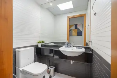 a bathroom with a toilet and a sink at StayShort - Premium 2BR in Dubai Marina - Sleeps 4 in Dubai