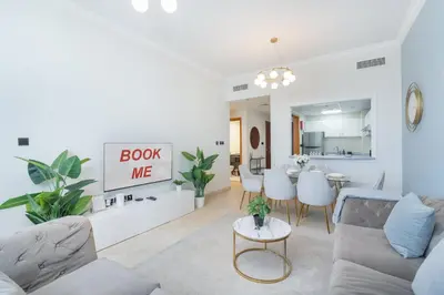 a living room with a couch and a table at StayShort - Premium 2BR in Dubai Marina - Sleeps 4 in Dubai