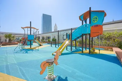 a playground with a slide and a monkey on it at StayShort - Extravagant Studio in DIFC with Skyline Views in Dubai