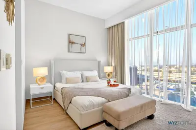 a bedroom with a large bed and a large window at Spacious and Luxurious 2 BD in Downtown Sleeps 8 with Maid Room in Dubai
