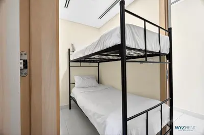 a bedroom with two bunk beds in a room at Spacious and Luxurious 2 BD in Downtown Sleeps 8 with Maid Room in Dubai