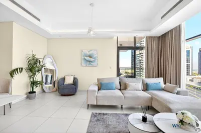 a living room with a couch and a table at Spacious and Luxurious 2 BD in Downtown Sleeps 8 with Maid Room in Dubai