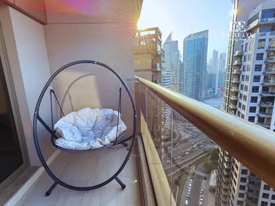 a bed on the balcony of a building at Spacious 1 Bed with Burj Khalifa View accommodates 3 or 4 in Dubai