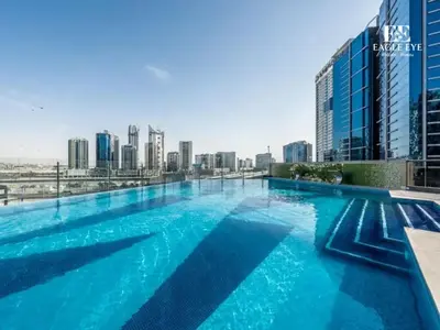 a large swimming pool on the roof of a building at Spacious 1 Bed with Burj Khalifa View accommodates 3 or 4 in Dubai