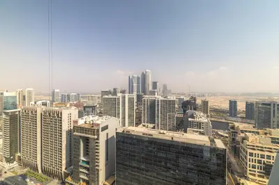 an aerial view of a city with tall buildings at Maison Privee - Chic Downtown Living with Dubai Cityscape Views in Dubai